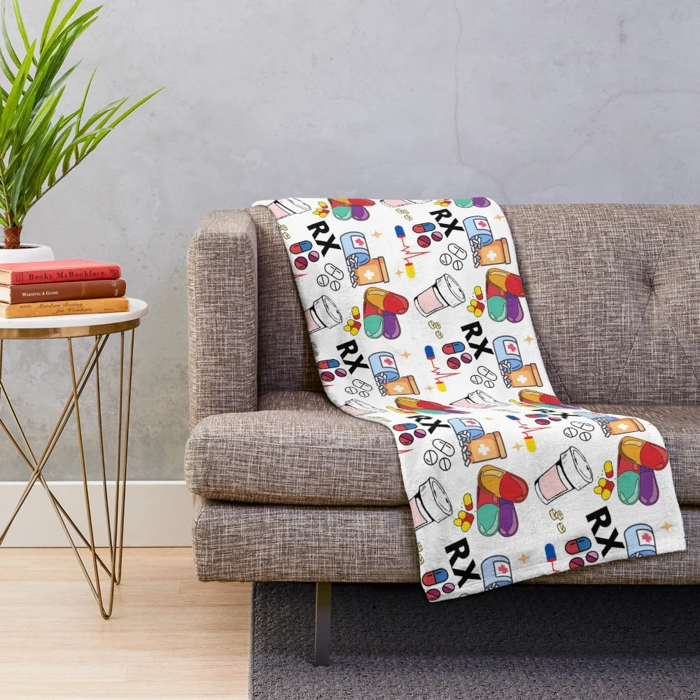 Plush blanket with pharmacy-inspired pill pattern design