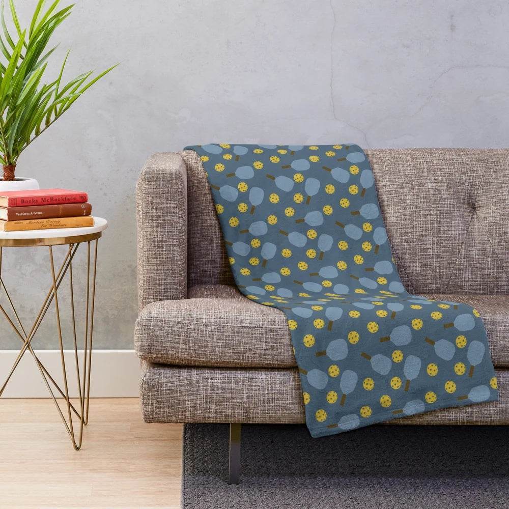 Blue pickleball pattern plush blanket with paddles and balls