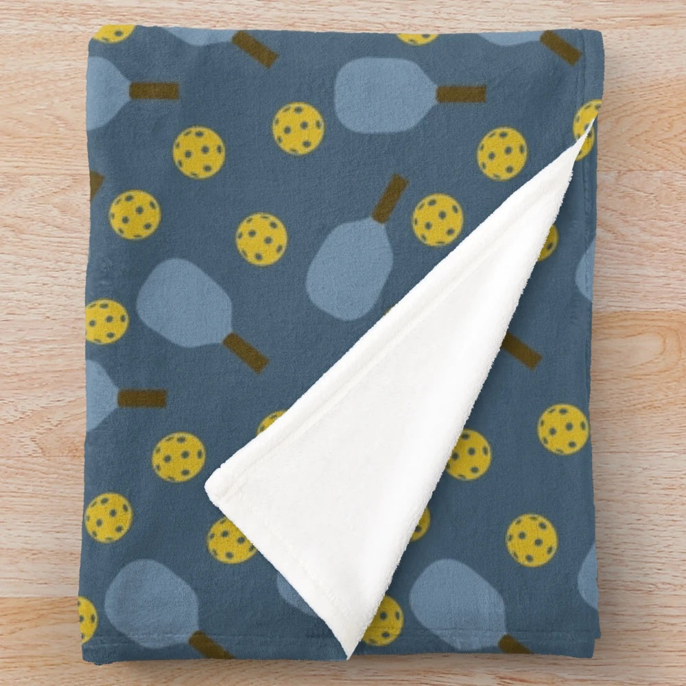 Blue pickleball pattern plush blanket with paddles and balls