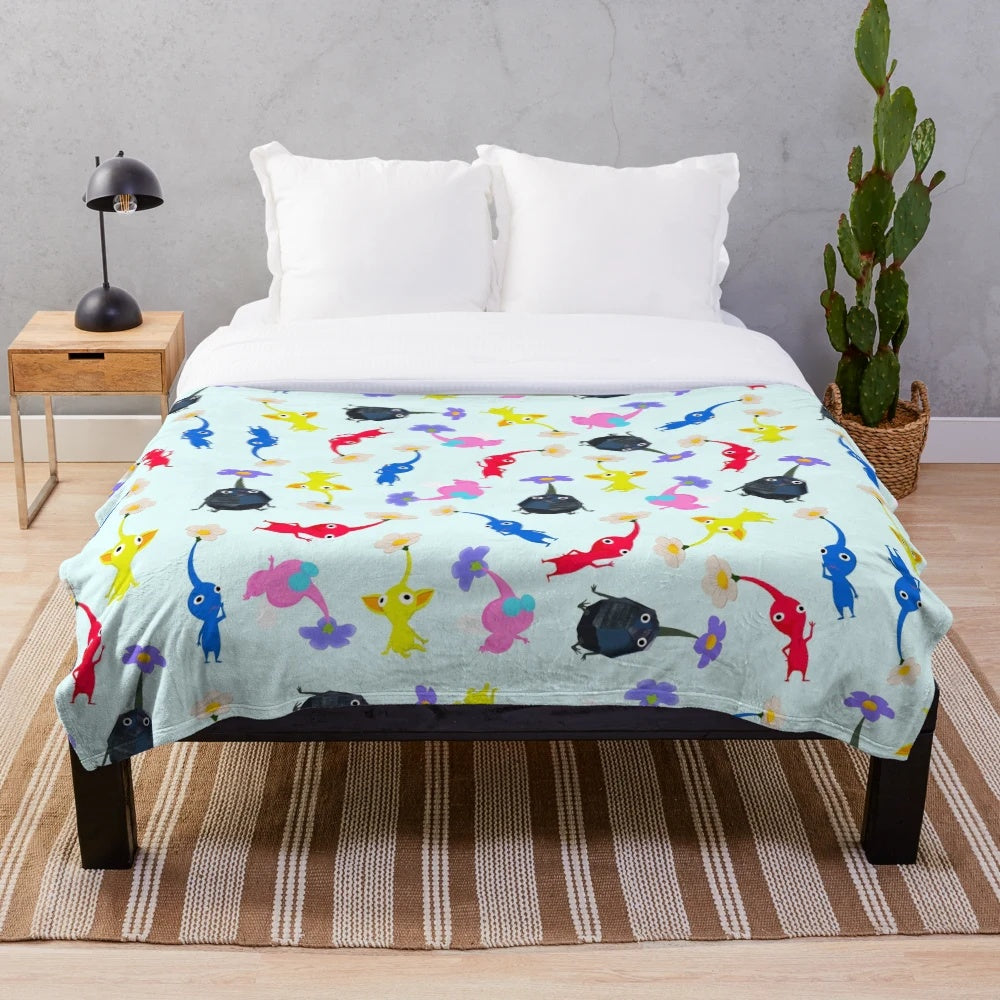 Pikmin themed plush blanket featuring Nintendo's iconic plant-like alien creatures
