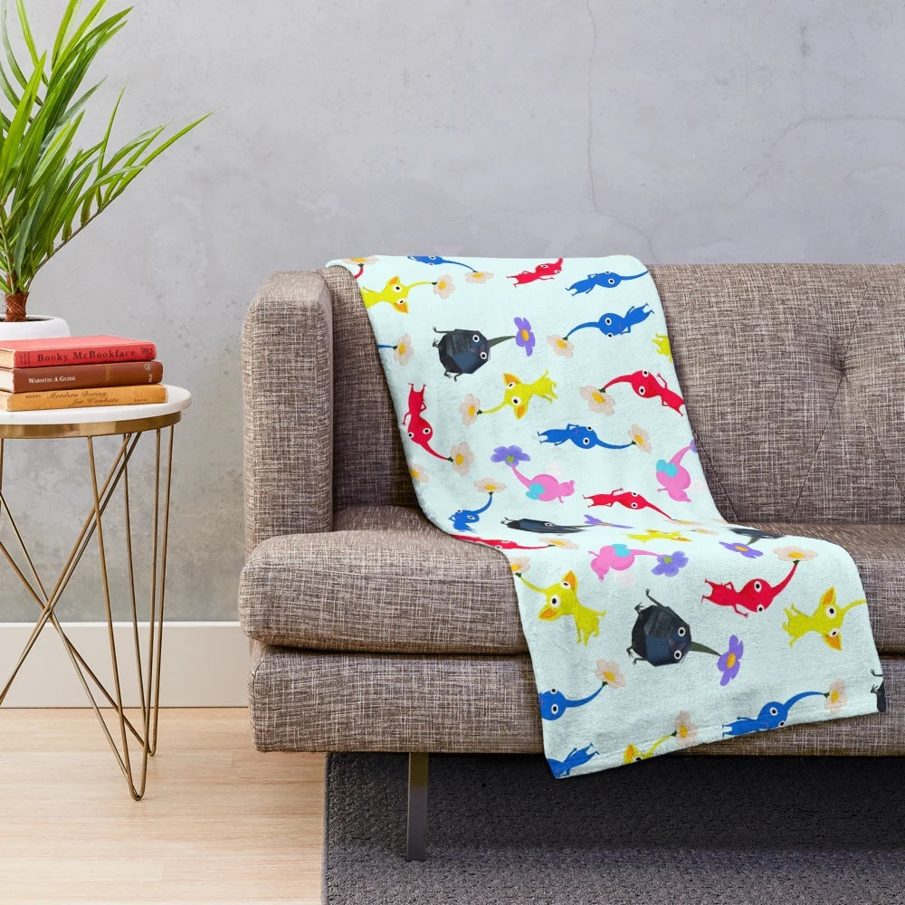 Pikmin themed plush blanket featuring Nintendo's iconic plant-like alien creatures