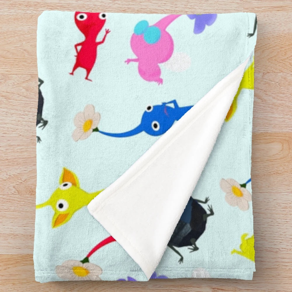 Pikmin themed plush blanket featuring Nintendo's iconic plant-like alien creatures