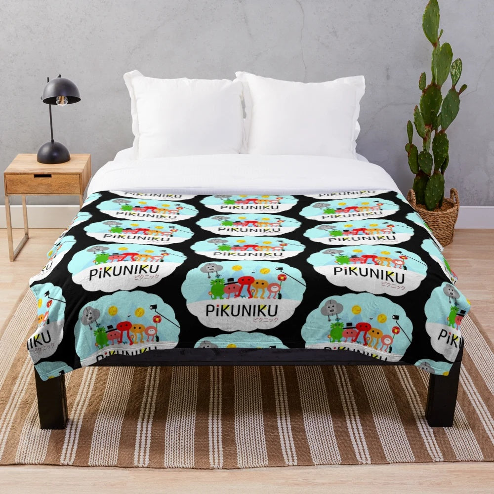 PIKUNIKU plush blanket featuring the game's adorable cartoon characters