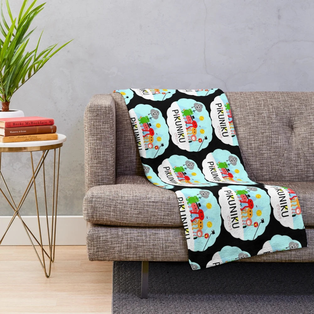PIKUNIKU plush blanket featuring the game's adorable cartoon characters