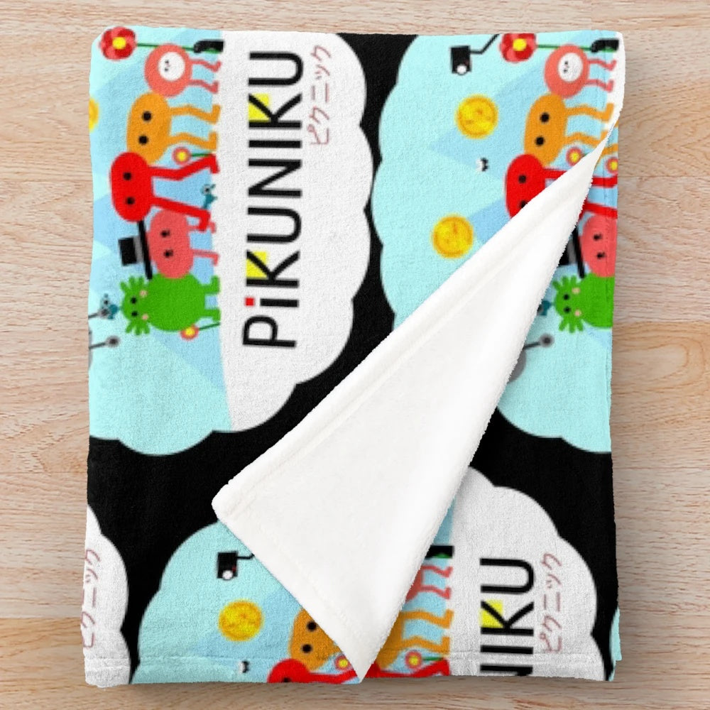 PIKUNIKU plush blanket featuring the game's adorable cartoon characters
