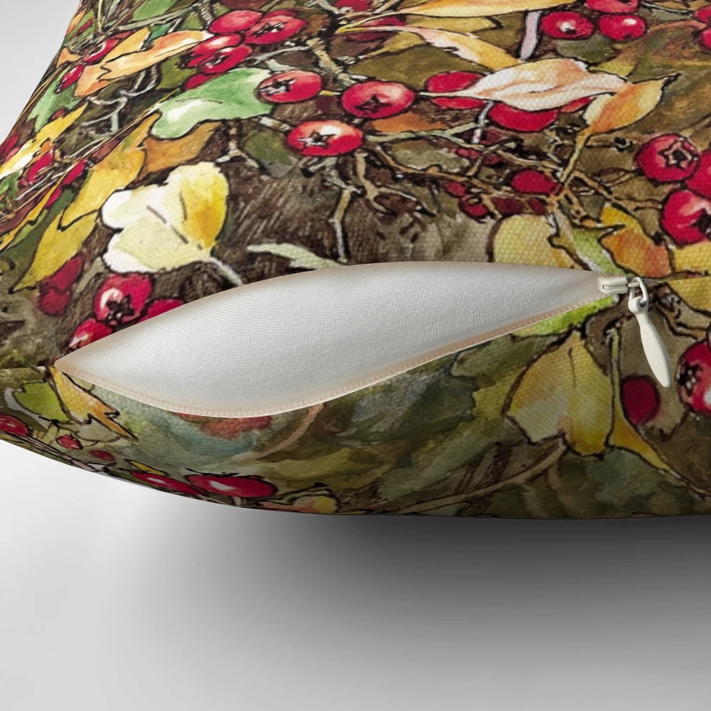 A plush pillow featuring a charming illustration of a blackthorn bush and berries, evoking the quintessential British countryside.