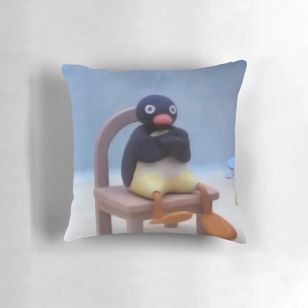 A soft, plush Pingu pillow - a comfy and decorative accent piece inspired by the popular British cartoon character.