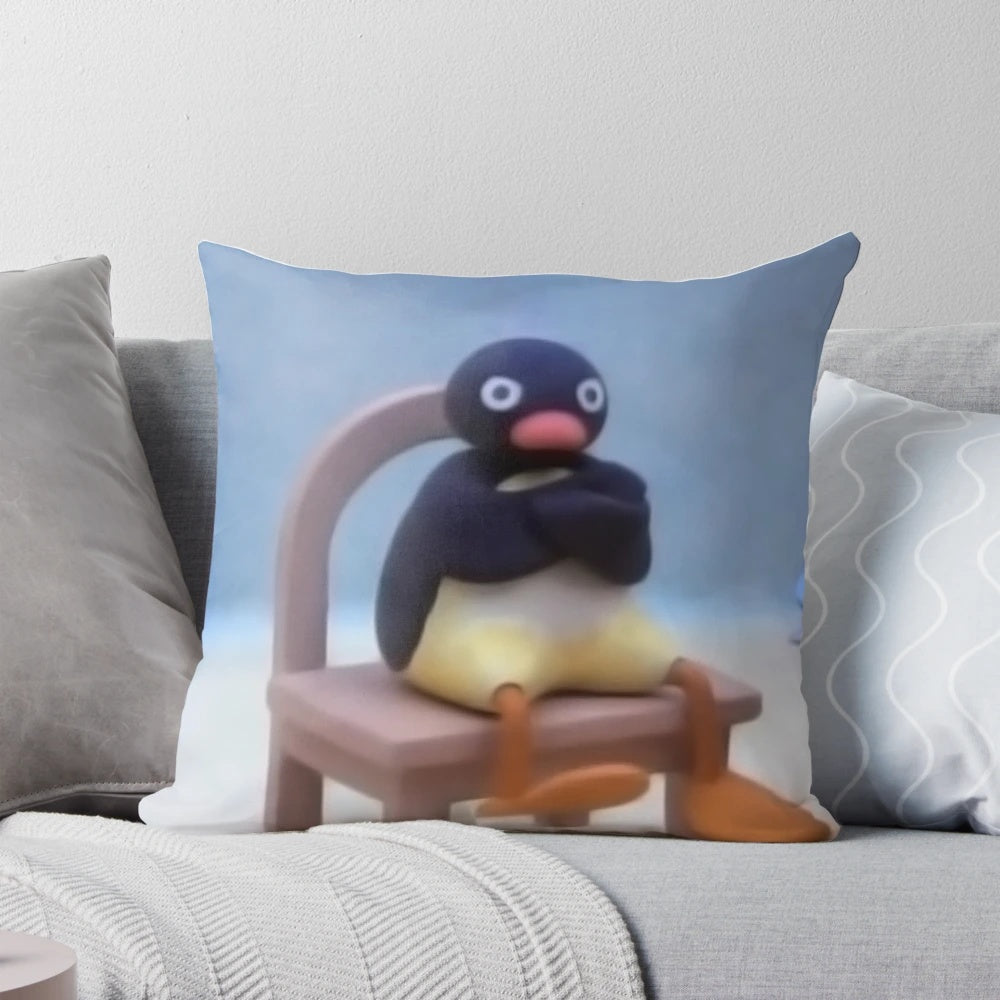 A soft, plush Pingu pillow - a comfy and decorative accent piece inspired by the popular British cartoon character.
