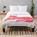 Pink and orange tiger patterned plush blanket