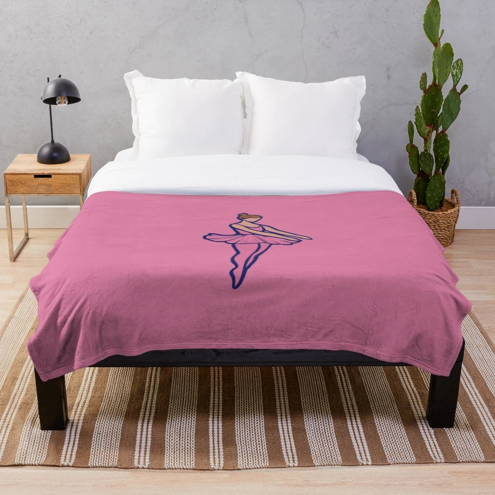 Soft and snuggly pink plush blanket featuring a ballet dancer design for girls