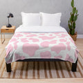 Soft and plush pink cow print blanket