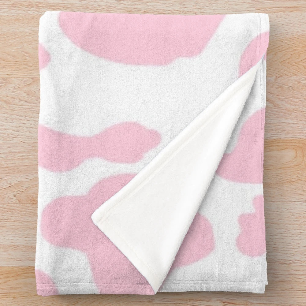 Soft and plush pink cow print blanket