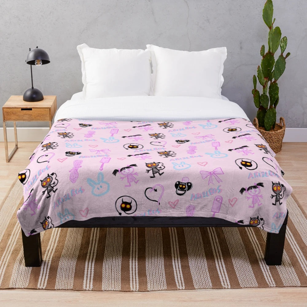 Soft and snuggly pink plush blanket with kawaii demon design