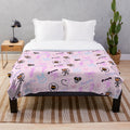 Soft and snuggly pink plush blanket with kawaii demon design
