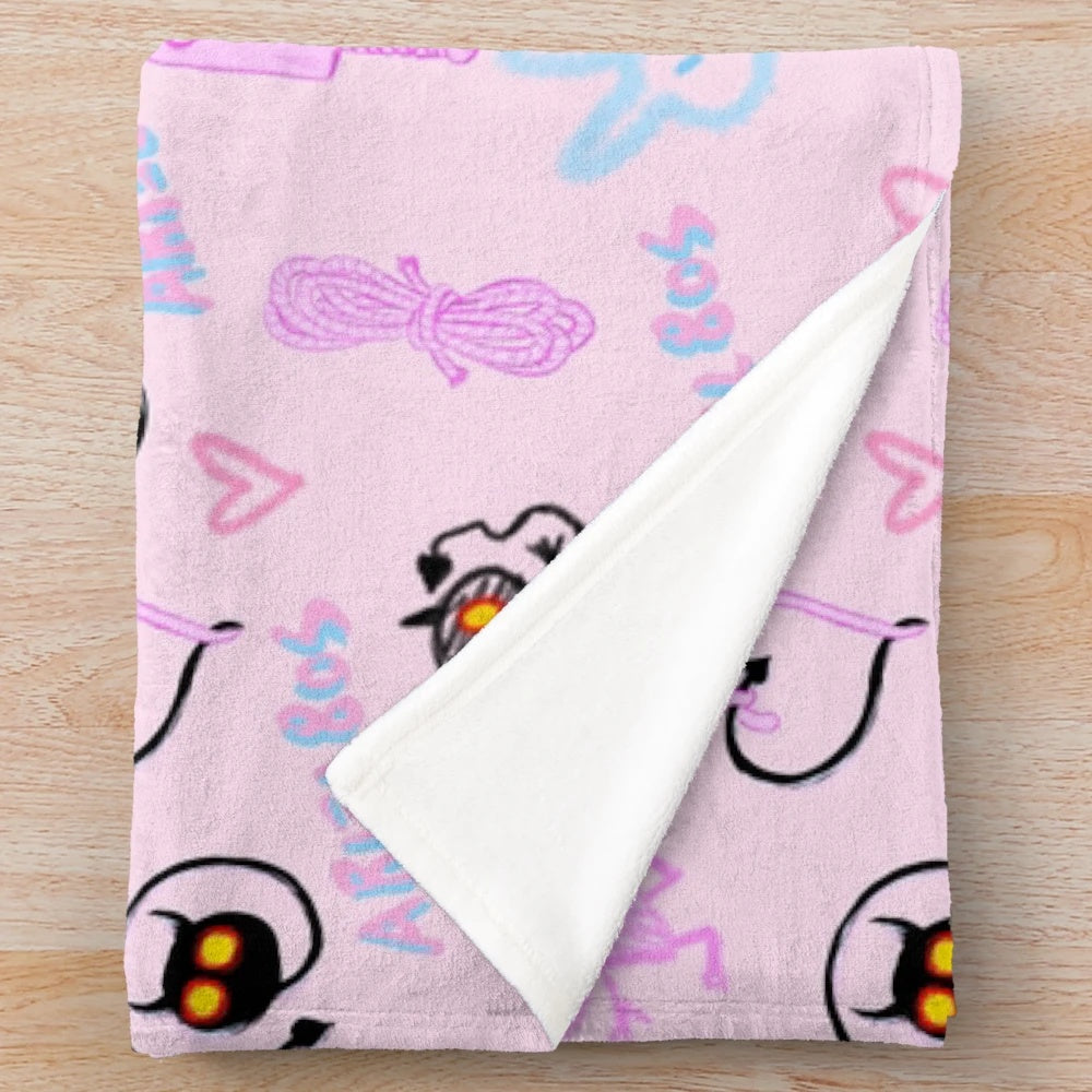 Soft and snuggly pink plush blanket with kawaii demon design