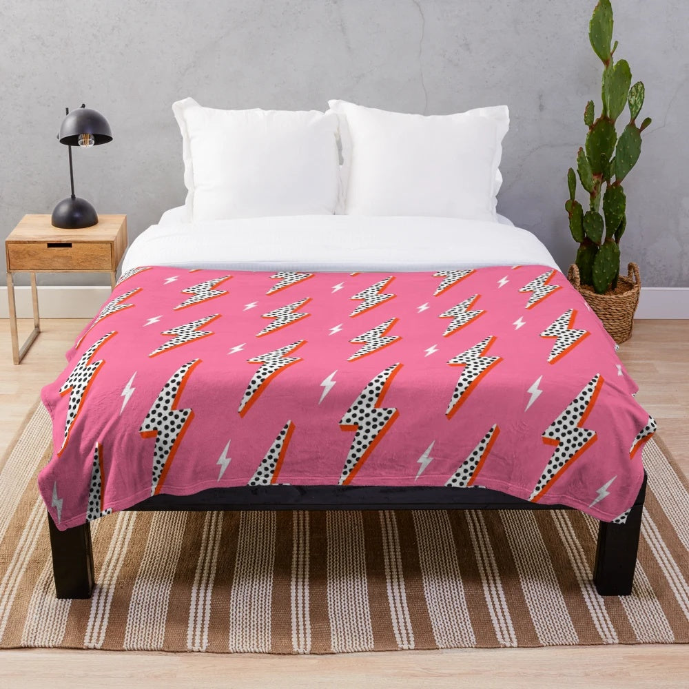 Pink lightning bolt plush blanket with a preppy design