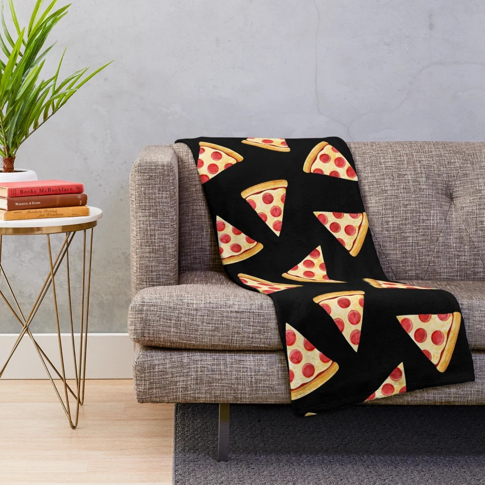 Plush pizza blanket featuring a pizza slice design on a black background