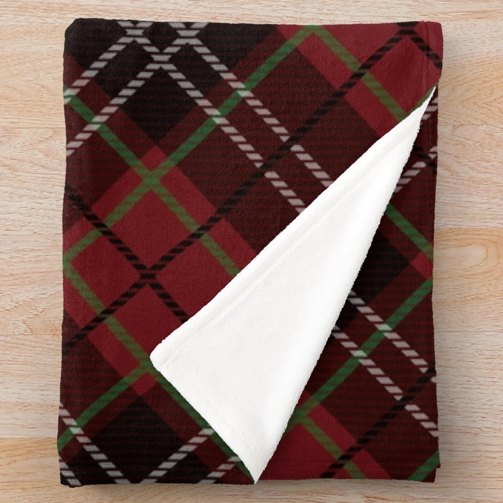 Cozy plaid blanket with traditional Scottish tartan pattern in red, white, and black