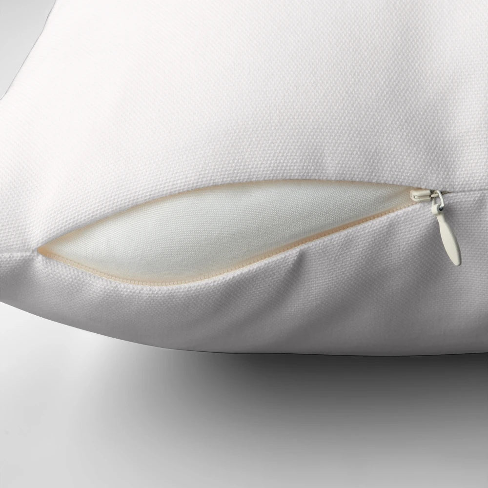 A plain white pillow with a simple, solid color design.