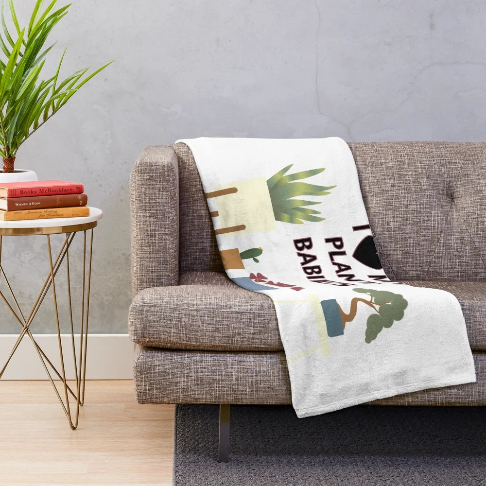 Soft and snuggly plush blanket featuring adorable plant illustrations