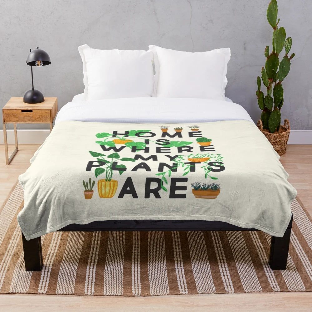 Plush blanket with a home is where my plants are design, featuring various houseplants and botanical elements