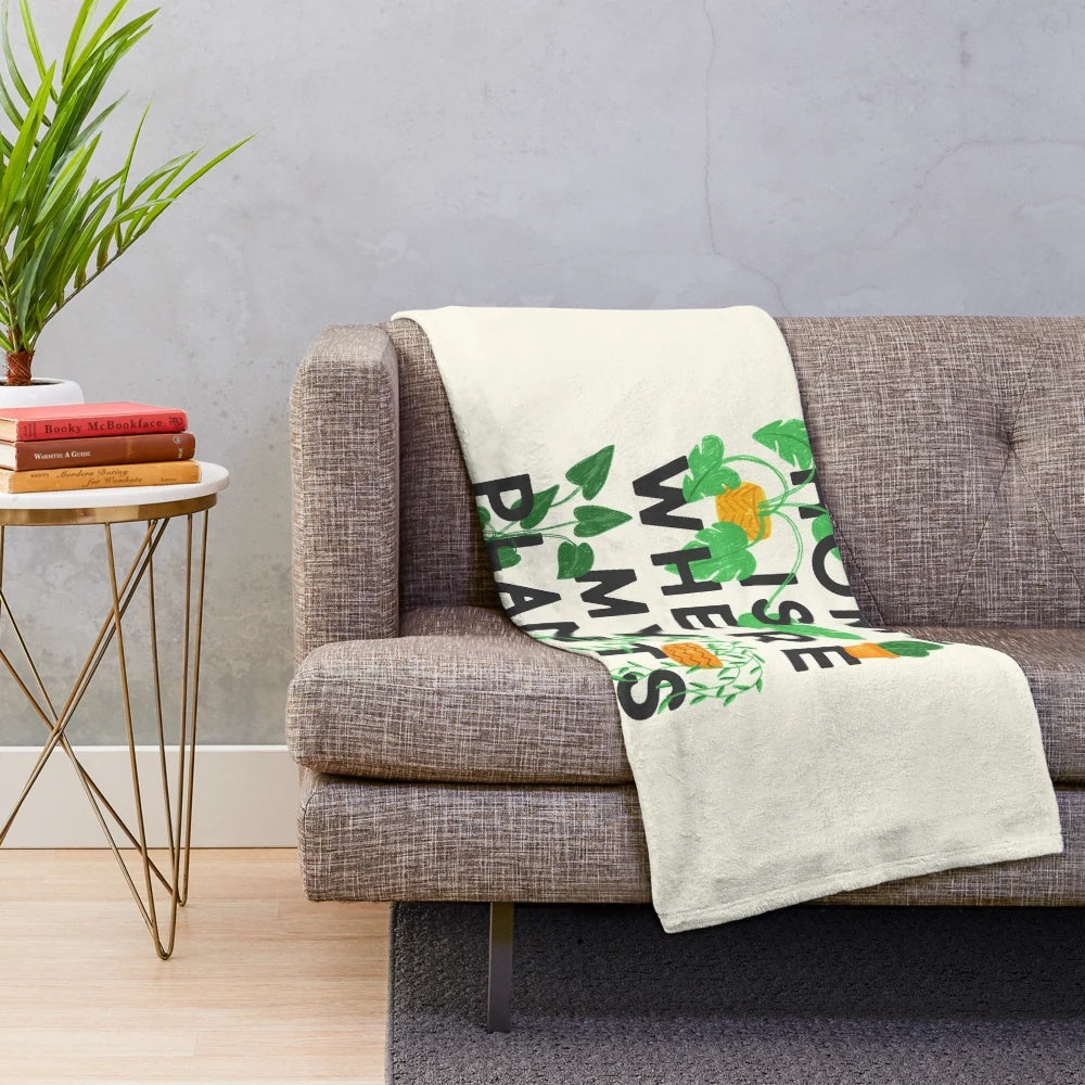 Plush blanket with a home is where my plants are design, featuring various houseplants and botanical elements