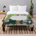 Plush plant-themed blanket with illustrations of houseplants