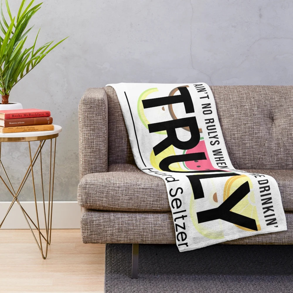 Plush "Ain't No Rulys" blanket featuring seltzer and college-themed design