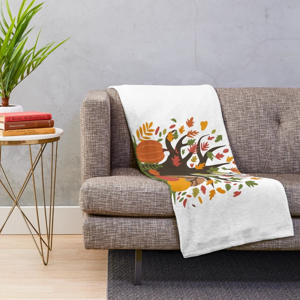 Soft, plush autumn-themed blanket with colorful leaves