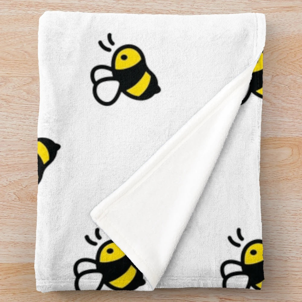 Plush bee pattern blanket for cozy relaxation
