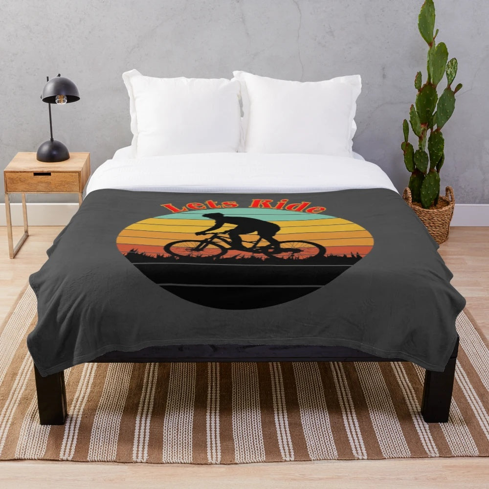 Plush bicycle-themed blanket for cozy outdoor activities