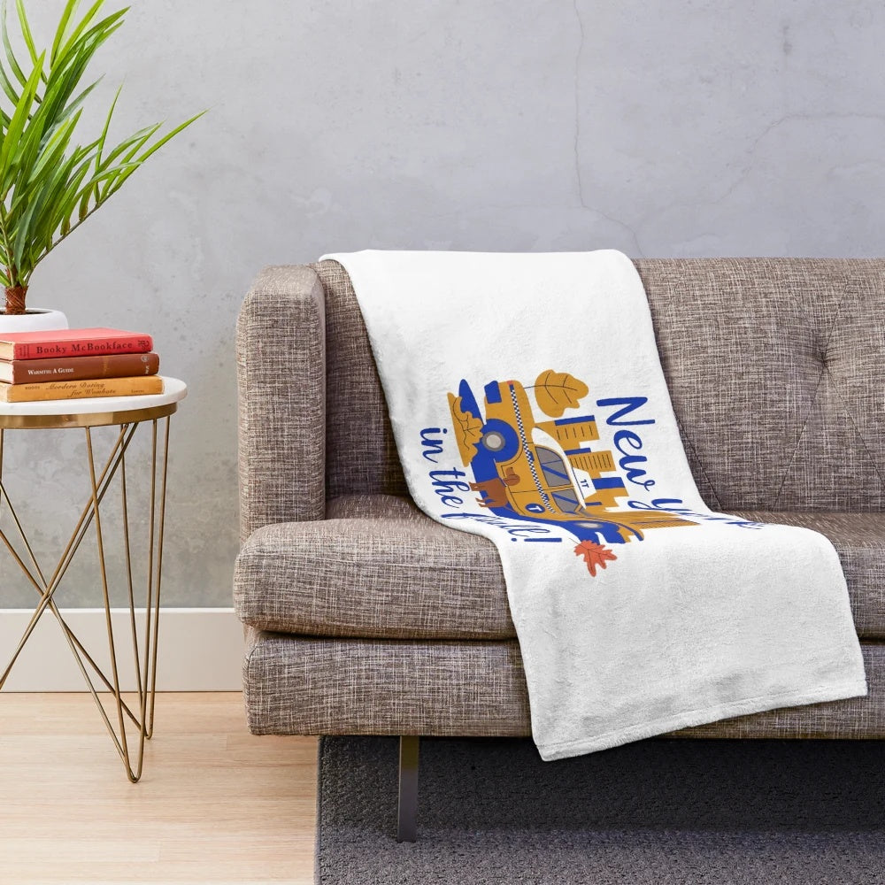 Plush blanket featuring the iconic scenes of New York City in the fall season