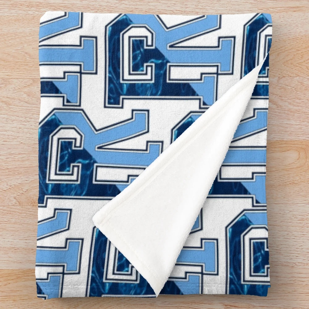 Plush blanket featuring the iconic Rhode Island state letters and coastal imagery