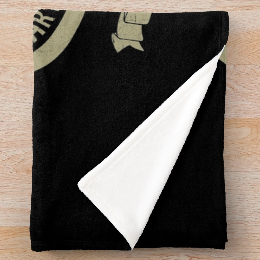 Plush blanket featuring the US Forest Service logo and imagery