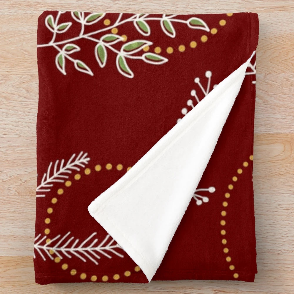 Plush Christmas and winter themed blanket with festive patterns and colors