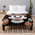 Plush blanket featuring a cute ghost design for Halloween