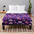 Plush blanket with a wonderland design featuring a cat and mushrooms