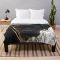 Black labrador retriever dog on a plush blanket