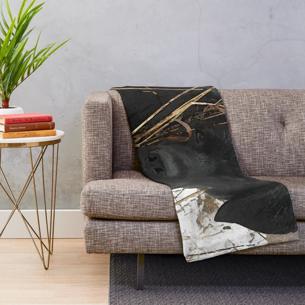 Black labrador retriever dog on a plush blanket