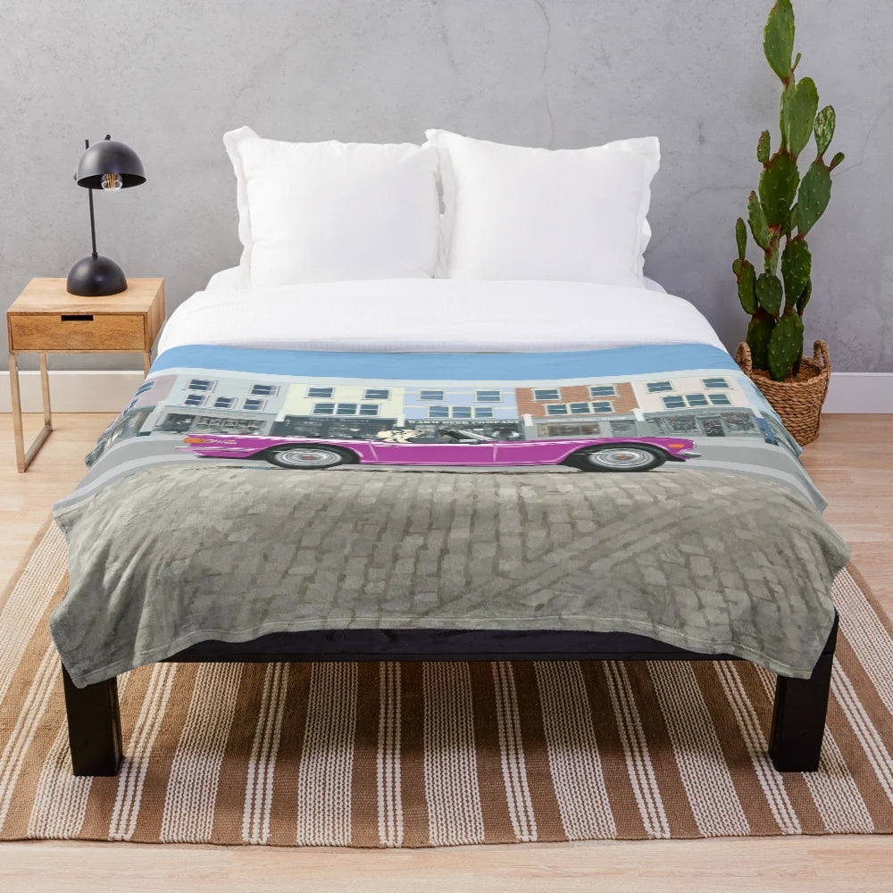 Plush blanket with a vintage Triumph TR6 sports car design