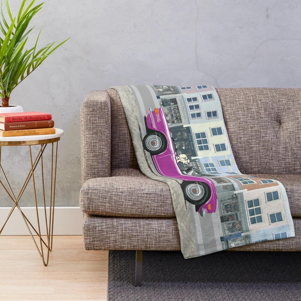 Plush blanket with a vintage Triumph TR6 sports car design