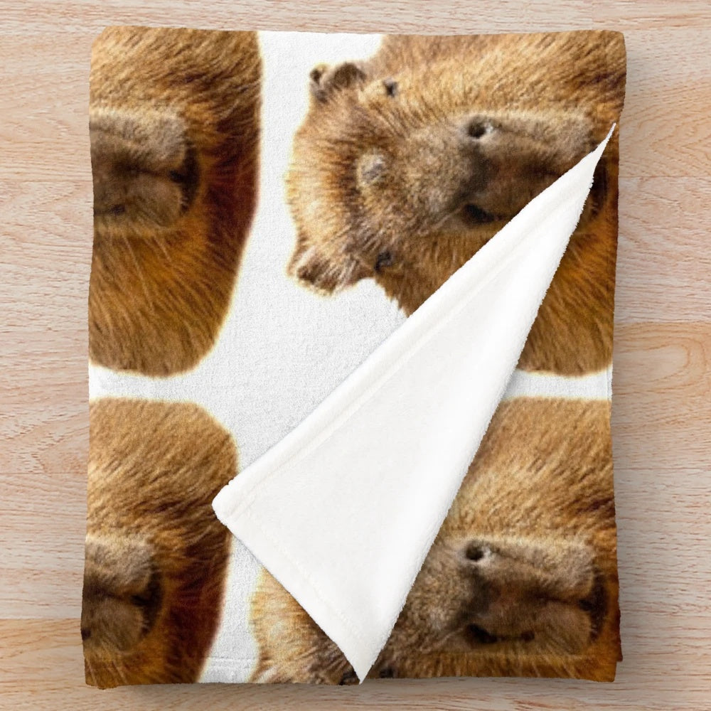 Plush blanket with an illustration of a capybara, a semi-aquatic South American rodent, relaxing in the sunshine.