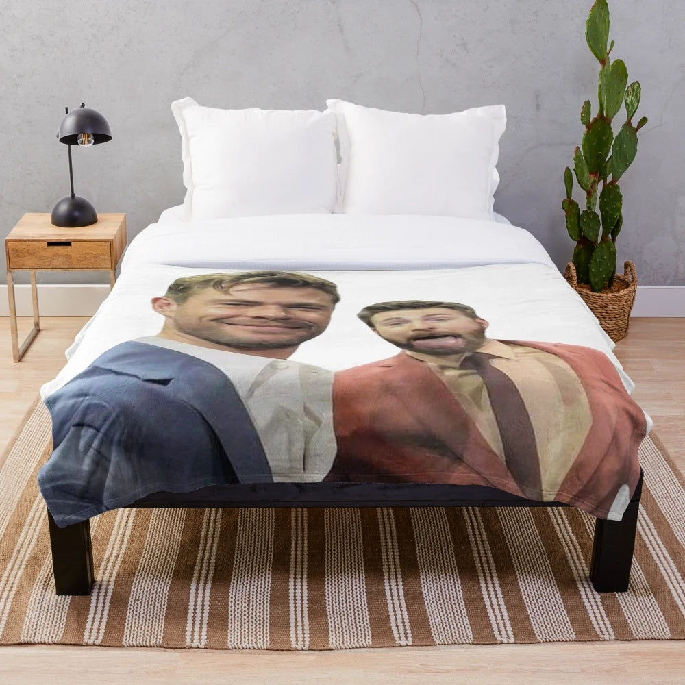 Plush blanket with images of Chris Evans and Chris Hemsworth, the popular Marvel movie stars
