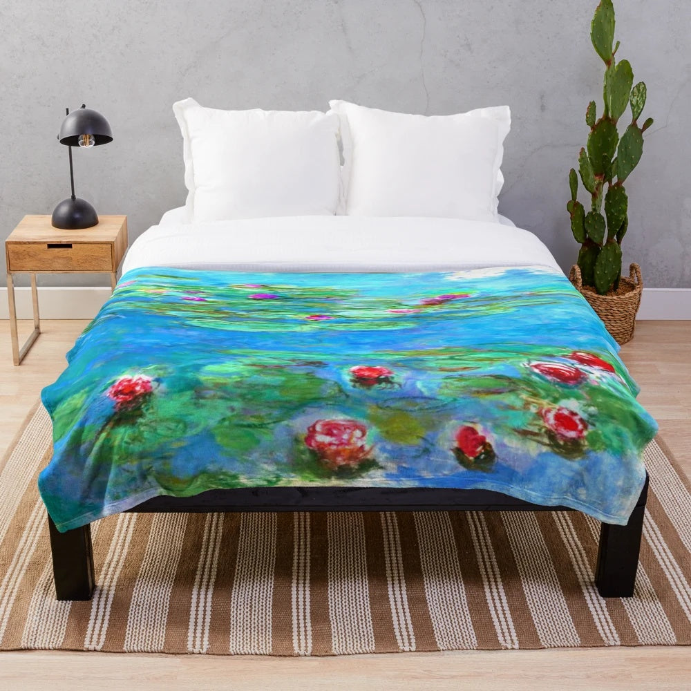 Plush blanket with Claude Monet's water lily painting in cyan blue hues