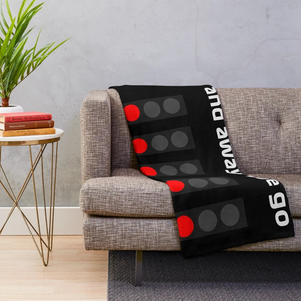 Plush blanket with F1 racing, commentators, and champions