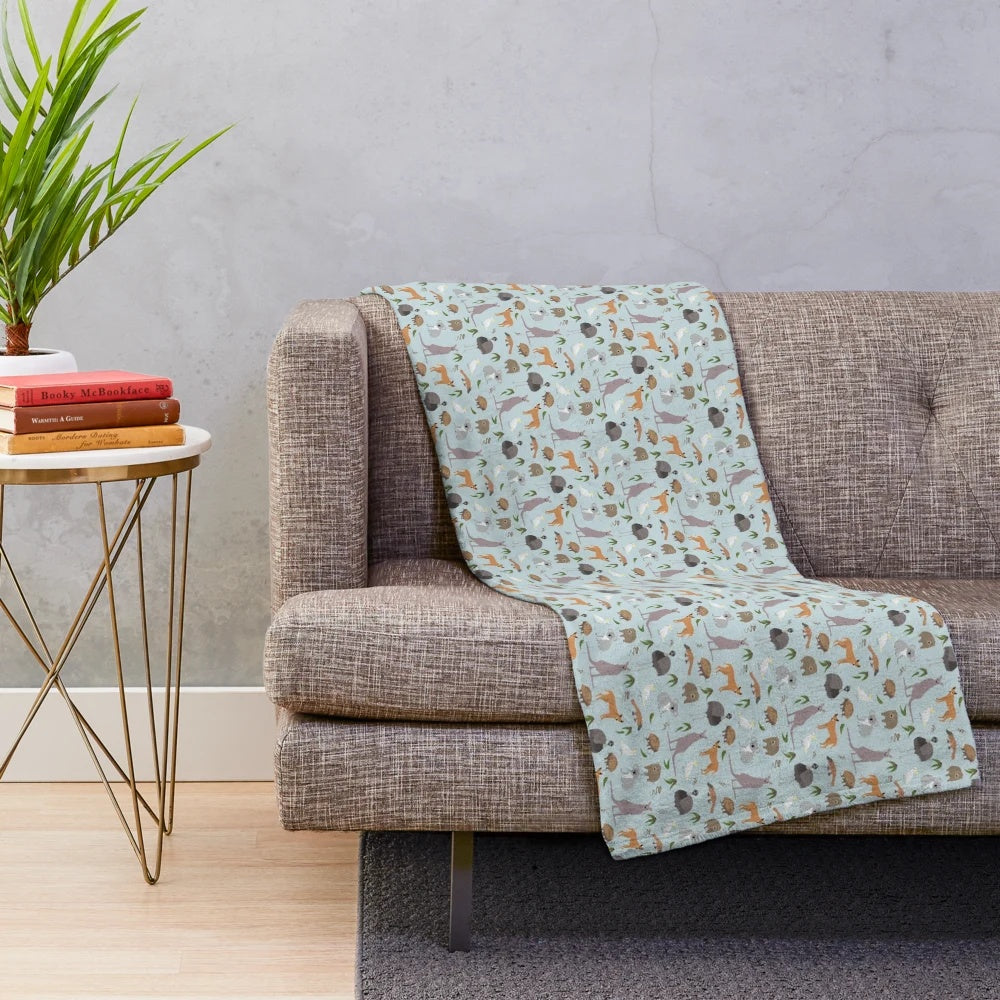 Plush blanket with koala, kangaroo, emu, and other Australian wildlife