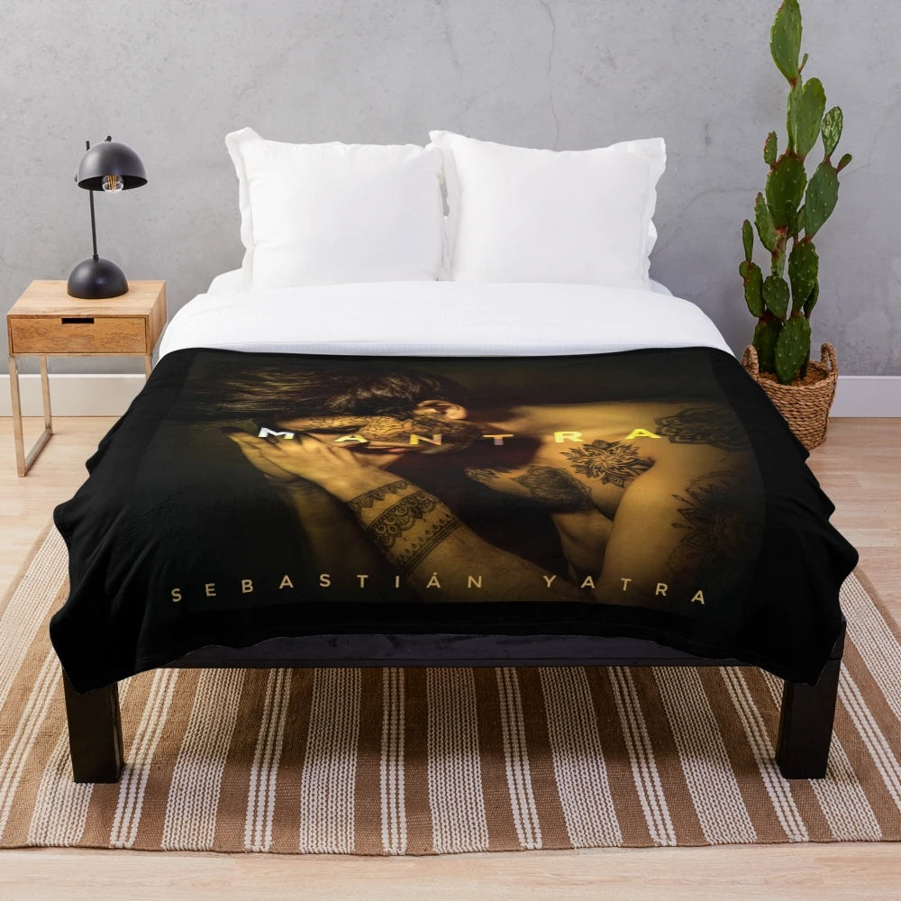 Plush blanket with the name and image of Latin music artist Sebastian Yatra's MANTRA