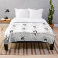 Shosty the Snowman plush blanket with musical notes and winter scene