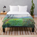 Plush blanket with snowdrop copse and nature landscape artwork by Jo Grundy