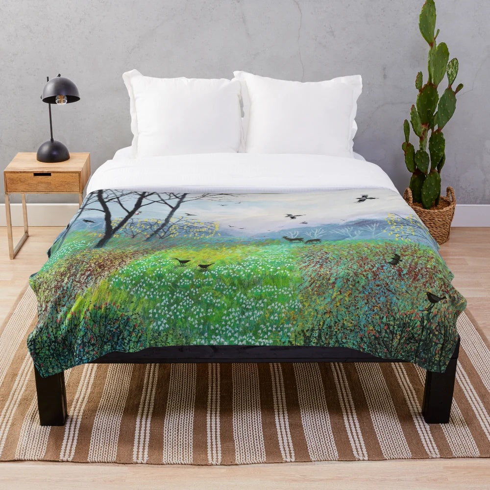 Plush blanket with snowdrop copse and nature landscape artwork by Jo Grundy
